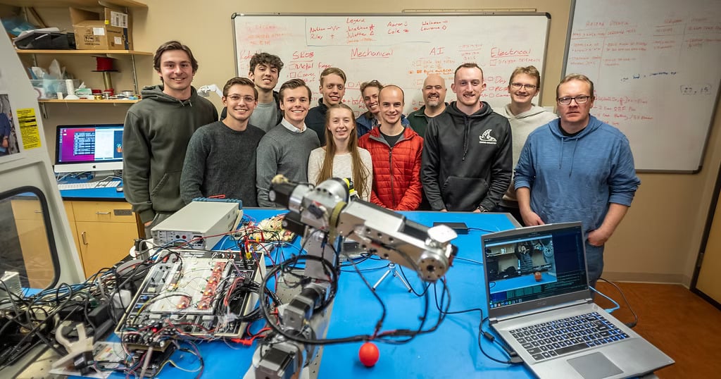 Students building with an AR4 in class